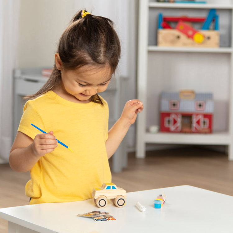 A kid playing with The DYO Bundle - Monster Truck & Train