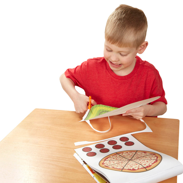 A child on white background with The Melissa & Doug Scissor Skills and Tape Activity Books Set