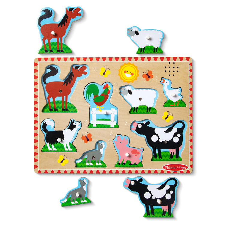 The loose pieces of The Melissa & Doug Farm Animals Sound Puzzle - Wooden Peg Puzzle With Sound Effects (8 pcs)