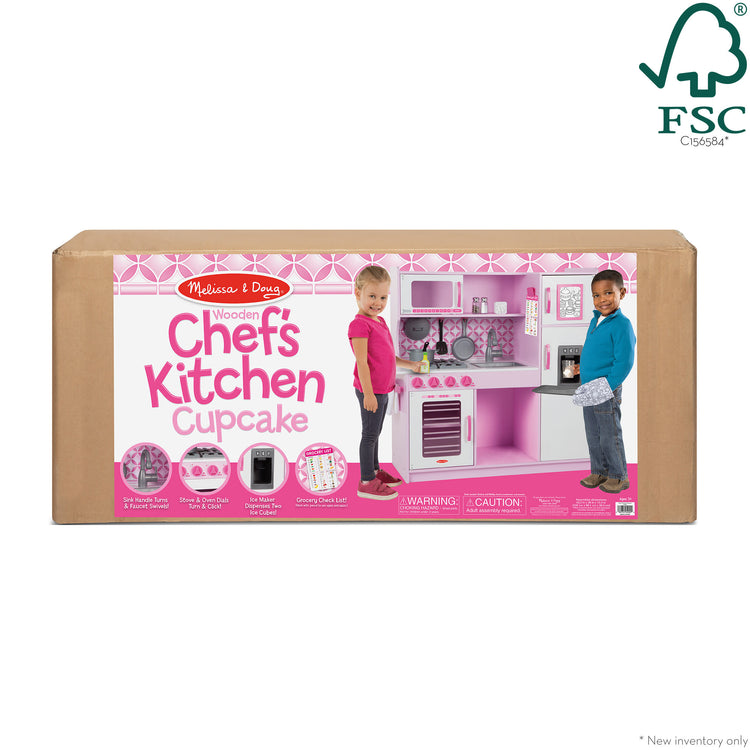 The front of the box for The Melissa & Doug Wooden Chef’s Pretend Play Toy Kitchen With “Ice” Cube Dispenser – Cupcake Pink/White