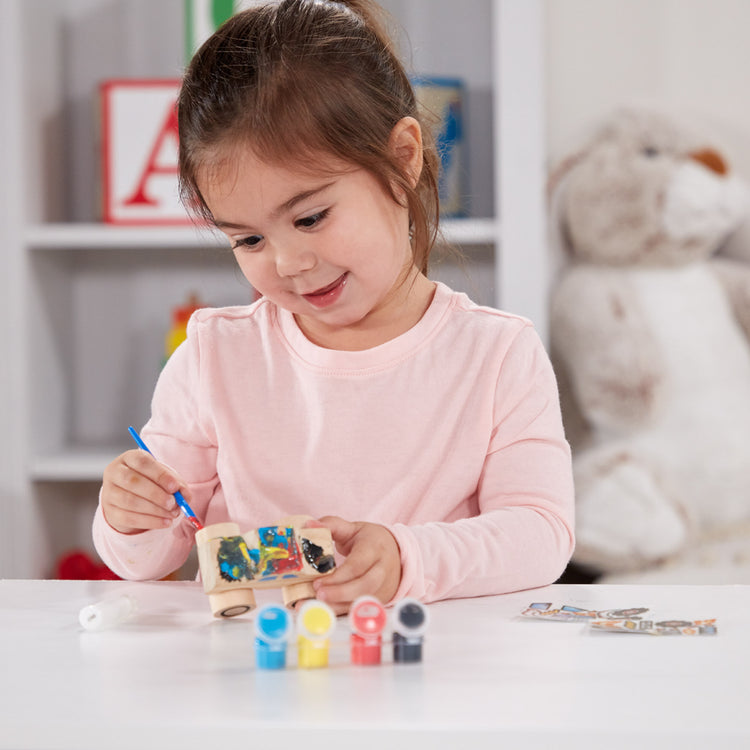 A kid playing with The DYO Bundle - Monster Truck & Train