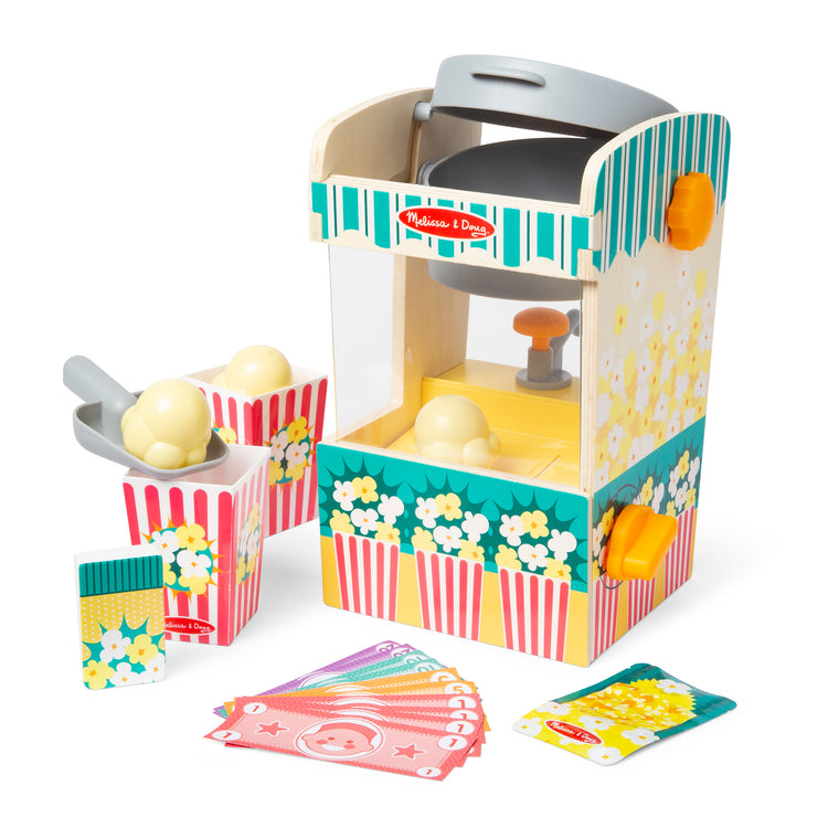 The loose pieces of The Melissa & Doug Fun at the Fair! Wooden Popcorn Popping Play Food Set