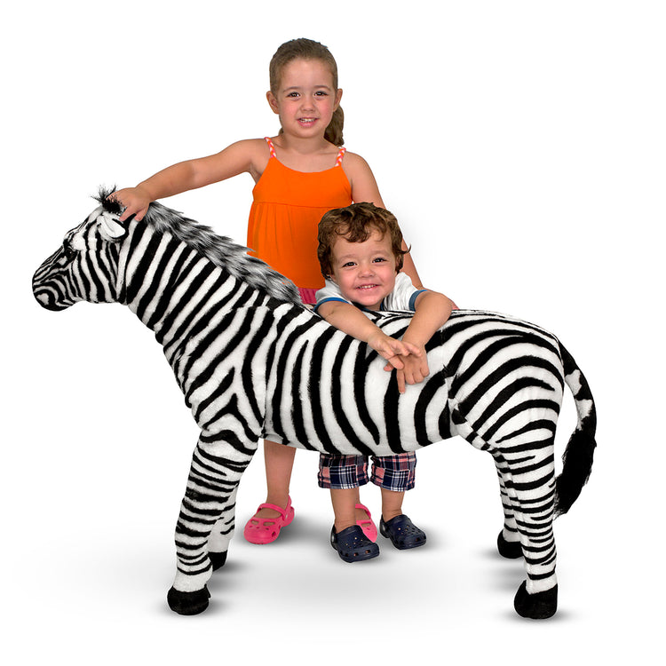 A child on white background with The Melissa & Doug Giant Striped Zebra - Lifelike Stuffed Animal (nearly 3 feet tall)