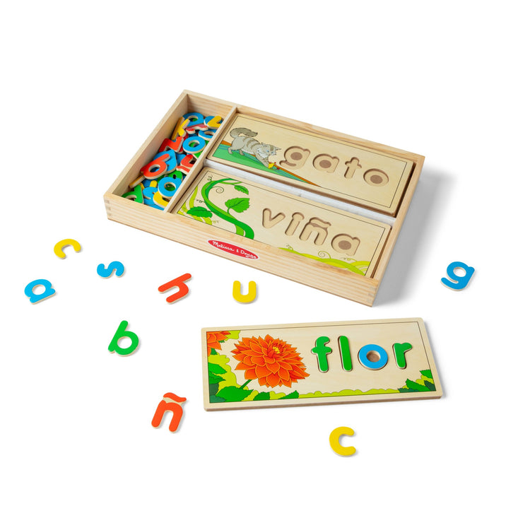 A kid playing with The Melissa & Doug Spanish See & Spell Educational Language Learning Toy