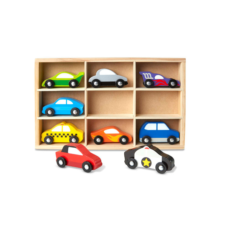 The loose pieces of The Melissa & Doug Wooden Cars Vehicle Set in Wooden Tray - 9 Pieces