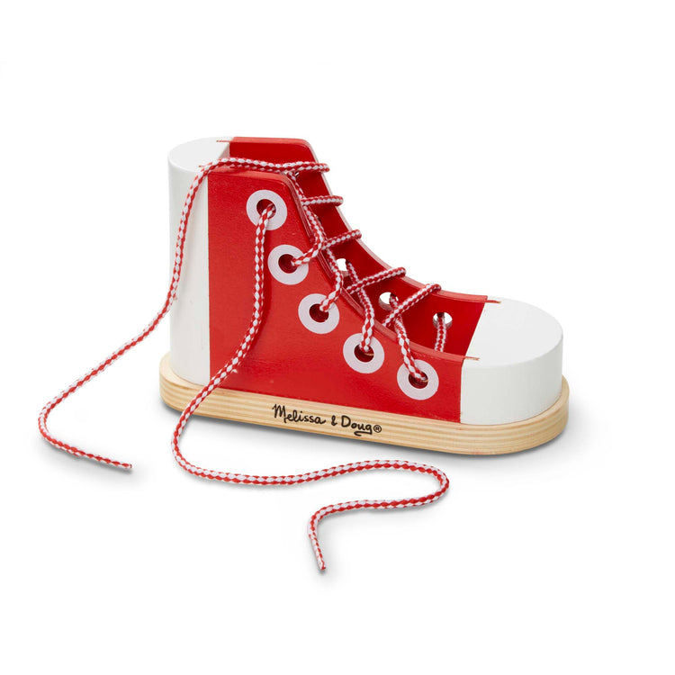 The front of the box for The Melissa & Doug Deluxe Wood Lacing Sneaker - Learn to Tie a Shoe Educational Toy