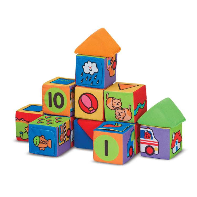 The loose pieces of The Melissa & Doug K's Kids Match and Build Soft Blocks Set