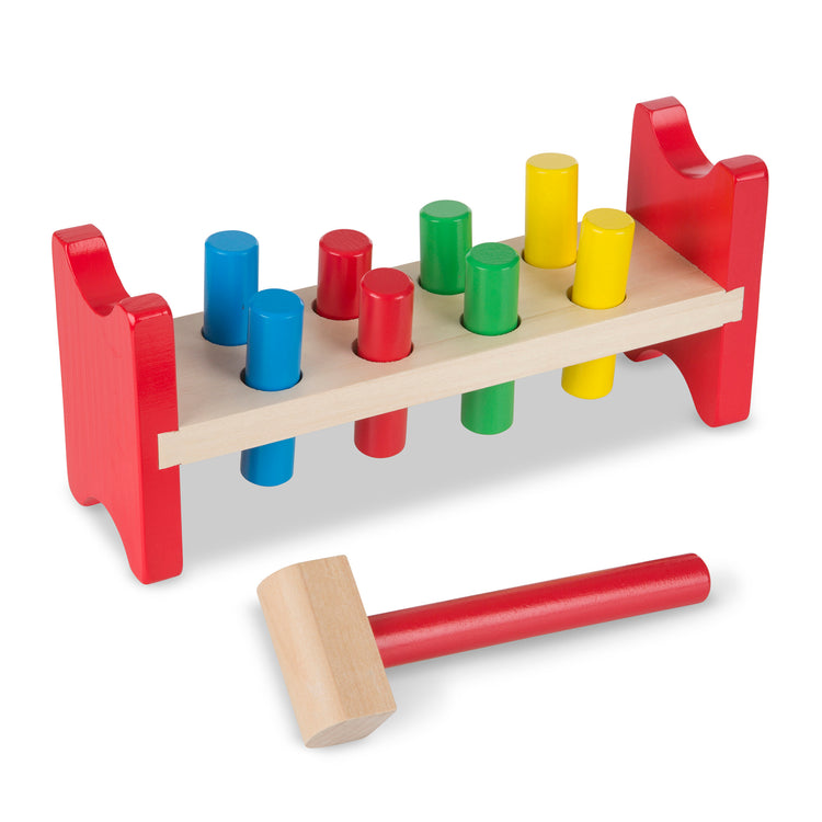 The loose pieces of The Melissa & Doug Deluxe Wooden Pound-A-Peg Toy With Hammer