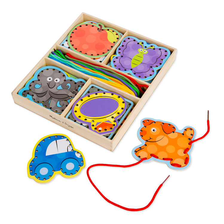 The loose pieces of The Melissa & Doug Alphabet Wooden Lacing Cards With Double-Sided Panels and Matching Laces