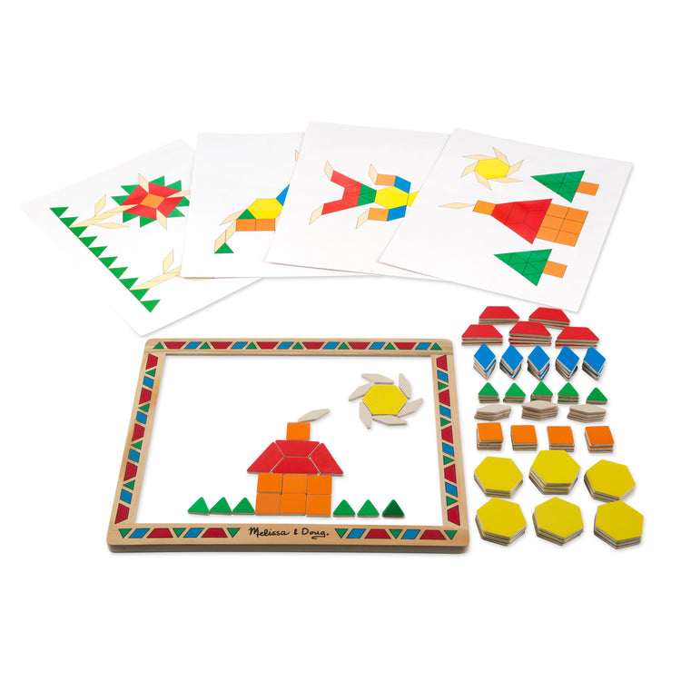 The loose pieces of The Melissa & Doug Deluxe Wooden Magnetic Pattern Blocks Set - Educational Toy With 120 Magnets and Carrying Case