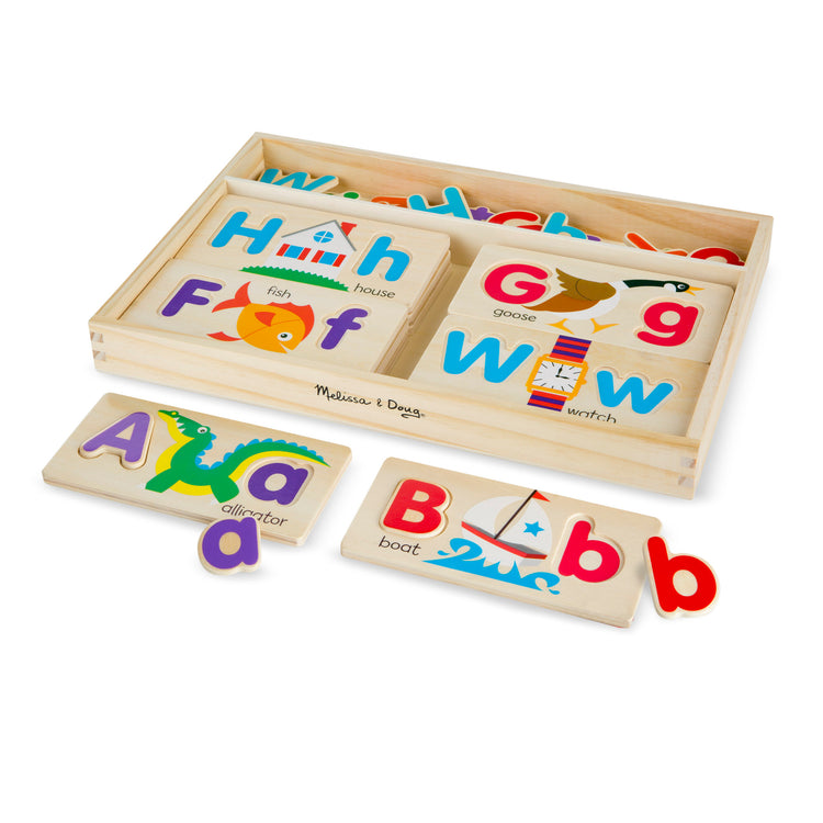 The loose pieces of The Melissa & Doug ABC Picture Boards - Educational Toy With 13 Double-Sided Wooden Boards and 52 Letters