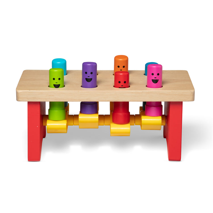 The loose pieces of The Melissa & Doug Deluxe Pounding Bench Wooden Preschool Learning Toy With Mallet