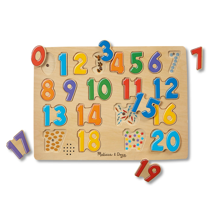 The loose pieces of The Melissa & Doug Numbers Sound Puzzle - Wooden Counting Puzzle With Sound Effects (21 pcs)