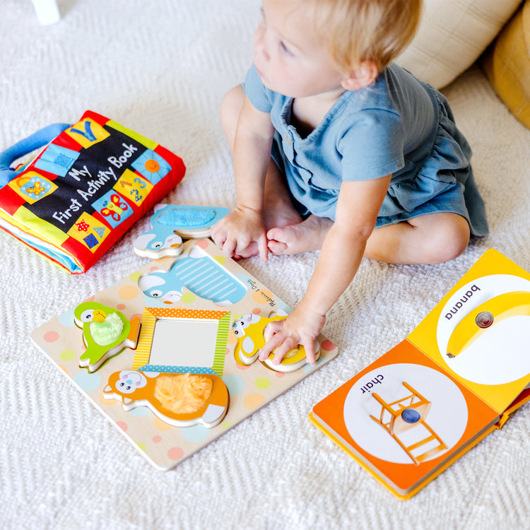 A kid playing with The My First" Collection Gift Set