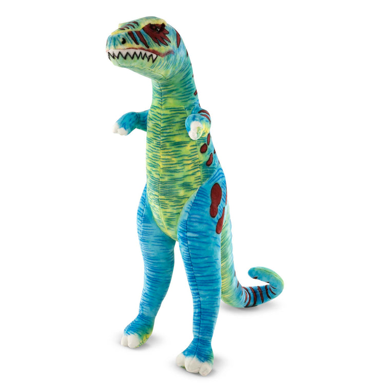 The loose pieces of The Melissa & Doug Standing T-Rex Giant Lifelike Plush Stuffed Animal