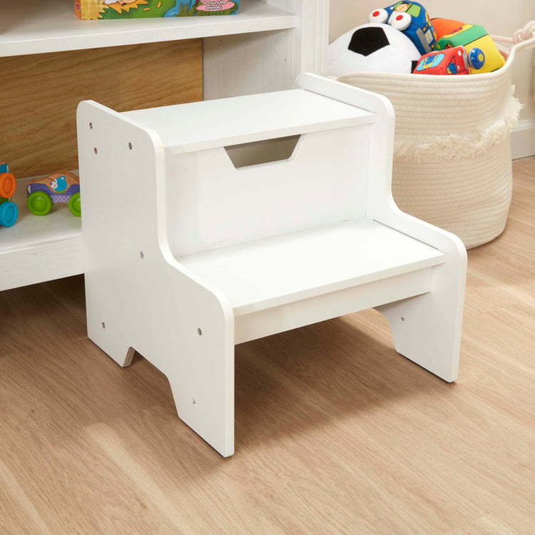 A kid playing with The Melissa & Doug Kids Wooden Step Stool - White