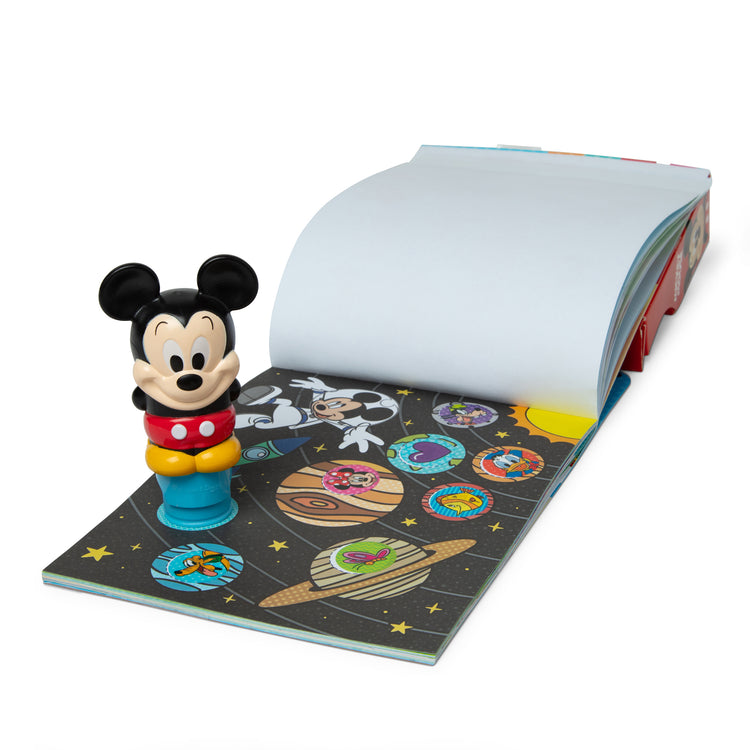 The loose pieces of The Melissa & Doug Sticker WOW!™ 24-Page Activity Pad and Sticker Stamper, 300 Stickers, Arts and Crafts Fidget Toy Collectible Character – Disney Mickey Mouse

