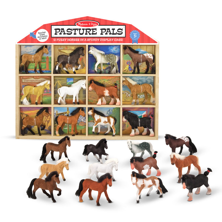 A kid playing with The Melissa & Doug Pasture Pals - 12 Collectible Horses With Wooden Barn-Shaped Crate