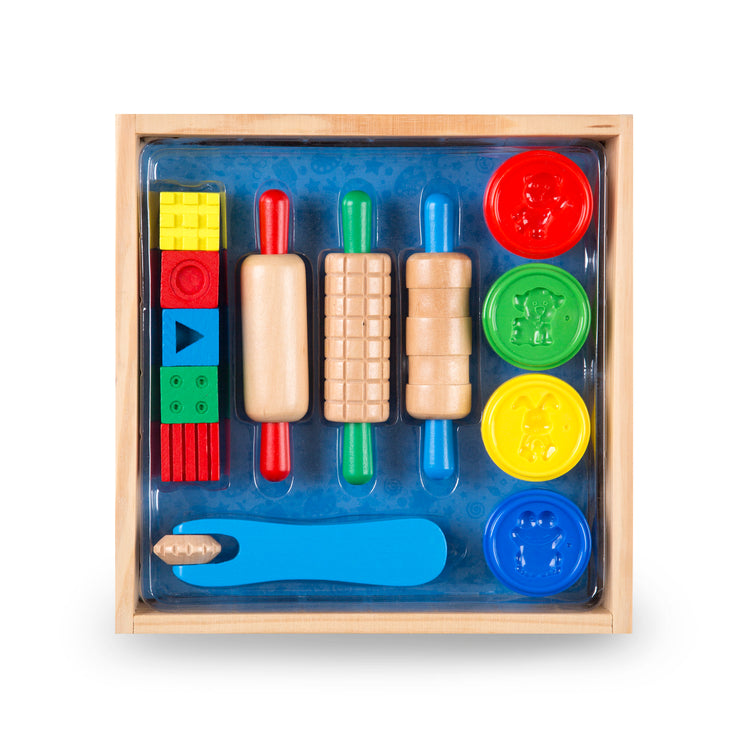 The front of the box for The Melissa & Doug Shape, Model, and Mold Craft Activity Set - 4 Tubs of Modeling Dough and Tools