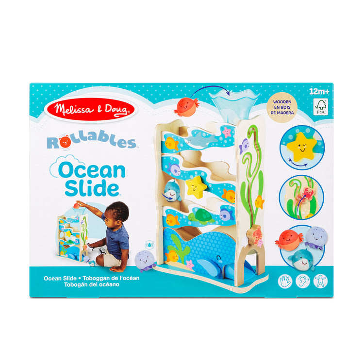 A kid playing with The Melissa & Doug Rollables Wooden Ocean Slide Infant and Toddler Toy (5 Pieces)