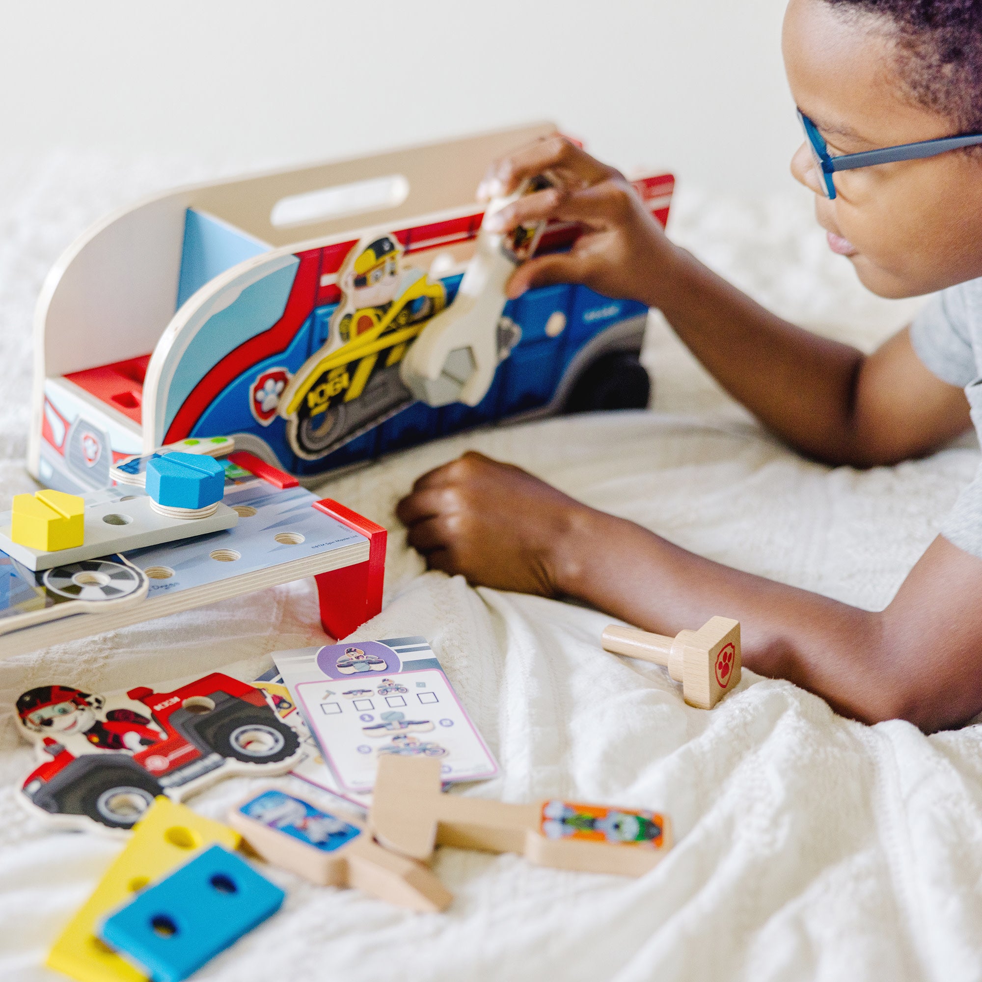 Boy playing with paw patrol clearance toys