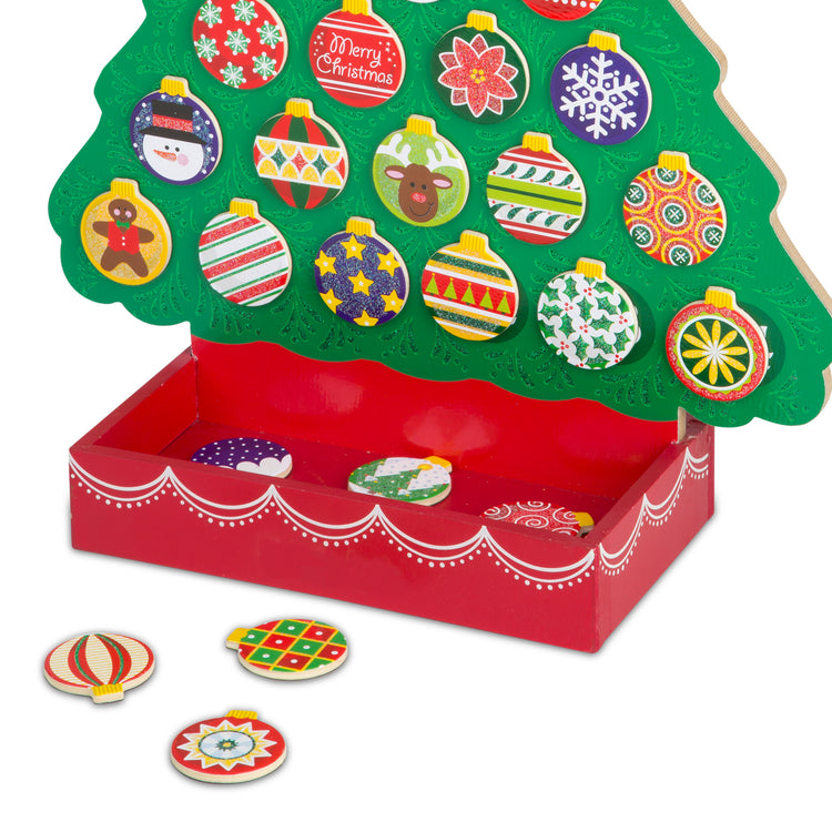 An assembled or decorated The Melissa & Doug Countdown to Christmas Wooden Advent Calendar - Magnetic Tree, 25 Magnets