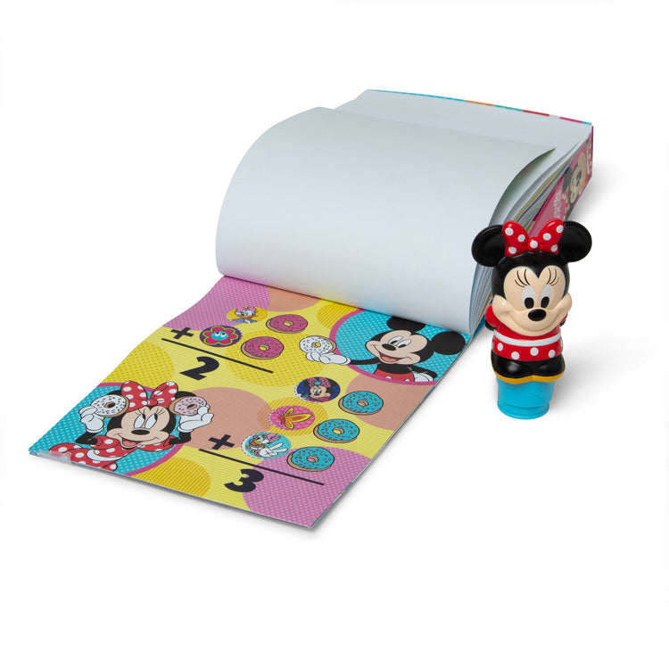 The loose pieces of The Melissa & Doug Sticker WOW!™ 24-Page Activity Pad and Sticker Stamper, 300 Stickers, Arts and Crafts Fidget Toy Collectible Character – Disney Minnie Mouse