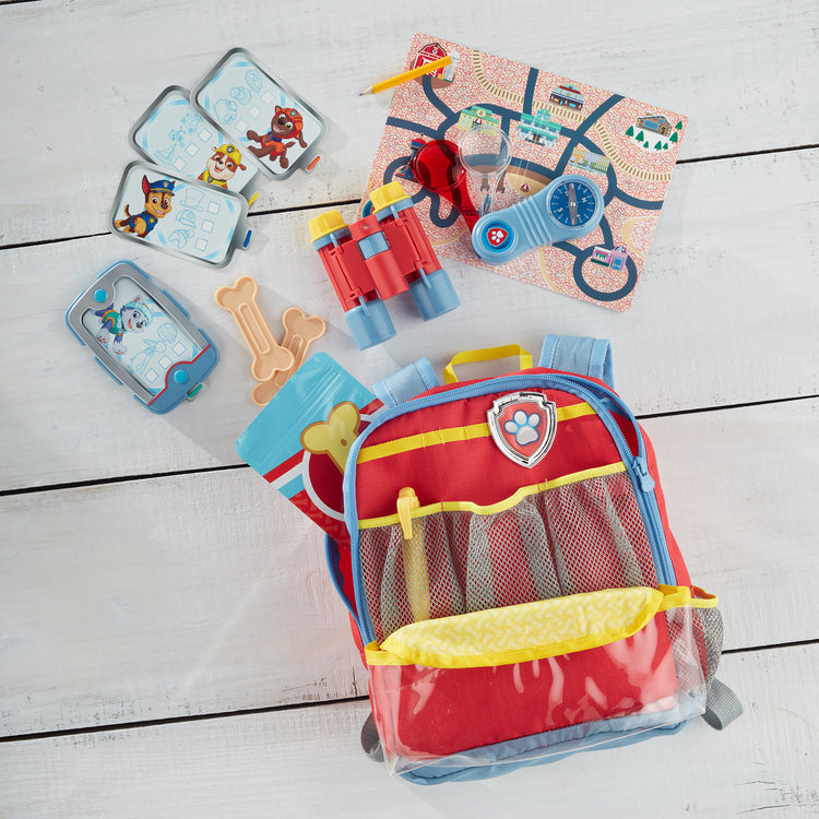 A playroom scene with The Melissa & Doug PAW Patrol Pup Pack Backpack Role Play Set (15 Pieces)