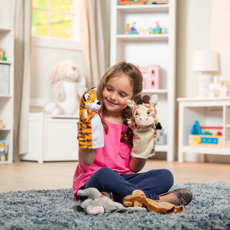 The loose pieces of The Melissa & Doug Zoo Friends Hand Puppets (Set of 4) - Elephant, Giraffe, Tiger, and Monkey