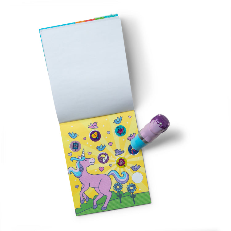 The loose pieces of The Melissa & Doug Sticker WOW!™ 24-Page Activity Pad and Sticker Stamper, 300 Stickers, Arts and Crafts Fidget Toy Collectible Character – Glitter Unicorn