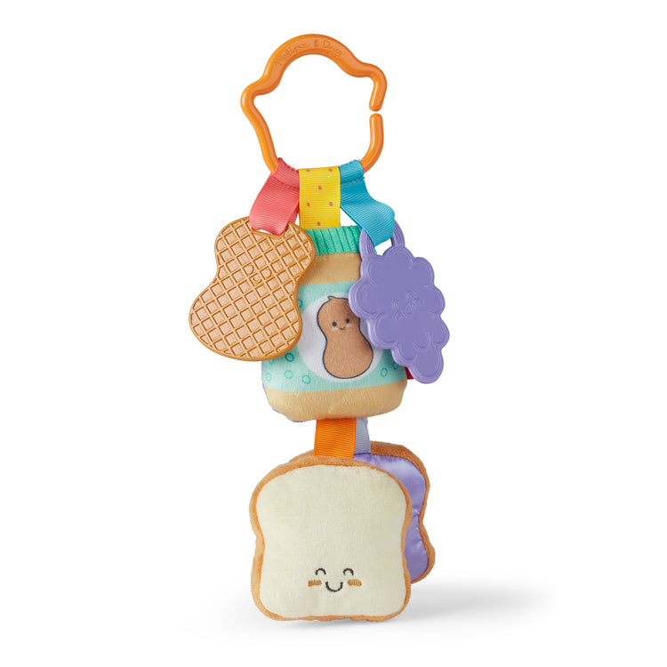 A kid playing with The Melissa & Doug Multi-Sensory PB&J Take-Along Clip-On Infant Toy