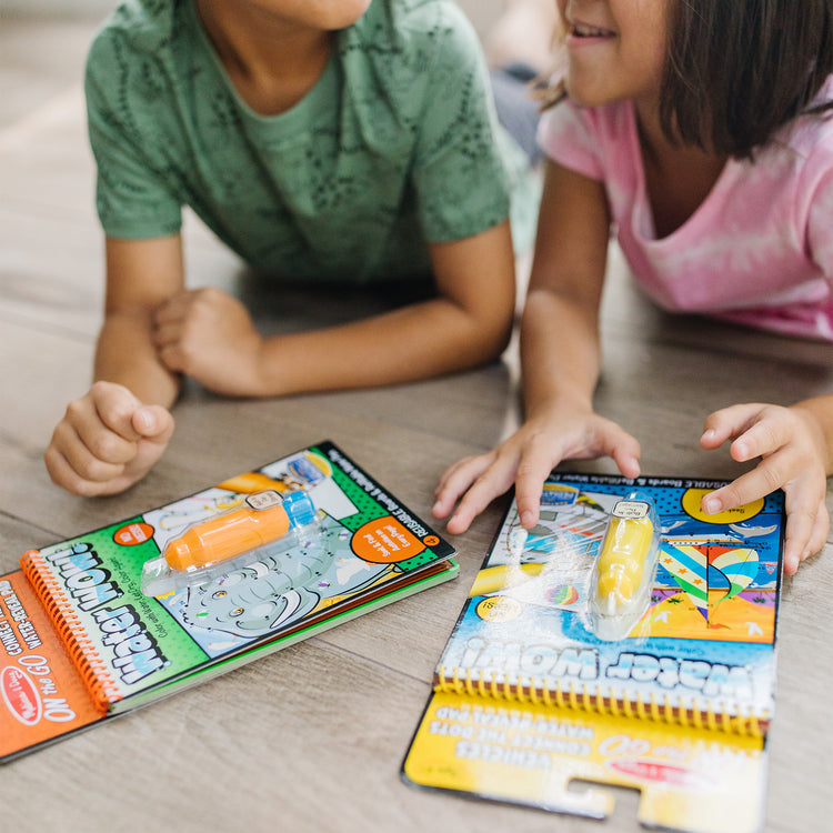 A kid playing with The Melissa & Doug On the Go Water Wow! Reusable Water-Reveal Connect the Dots Activity Pad – Safari