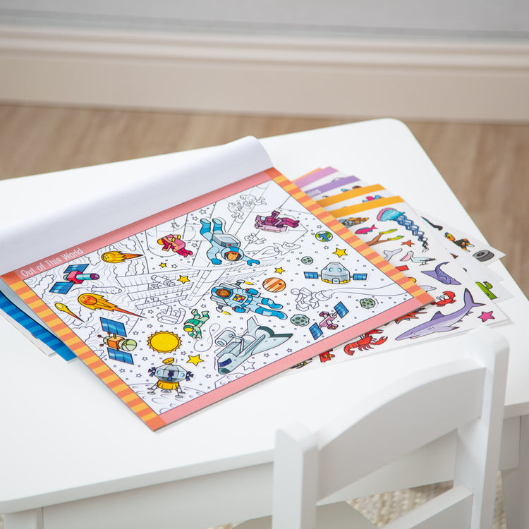 A playroom scene with The Melissa & Doug Seek and Find Sticker Pad – Adventure (400+ Stickers, 14 Scenes to Color)