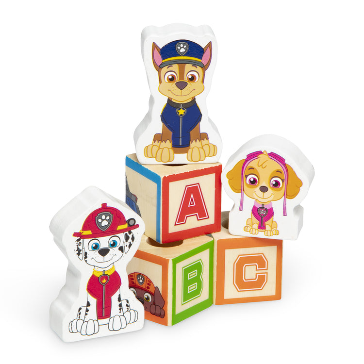 The loose pieces of The Melissa & Doug PAW Patrol Wooden ABC Block Truck (33 Pieces)