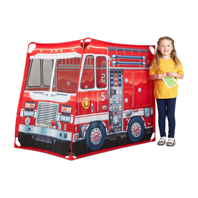 A child on white background with The Melissa & Doug Fire Truck Play Tent
