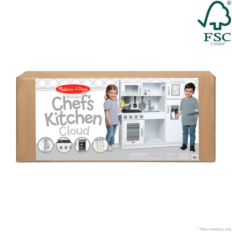 The front of the box for The Melissa & Doug Wooden Chef’s Pretend Play Toy Kitchen With “Ice” Cube Dispenser – Cloud White