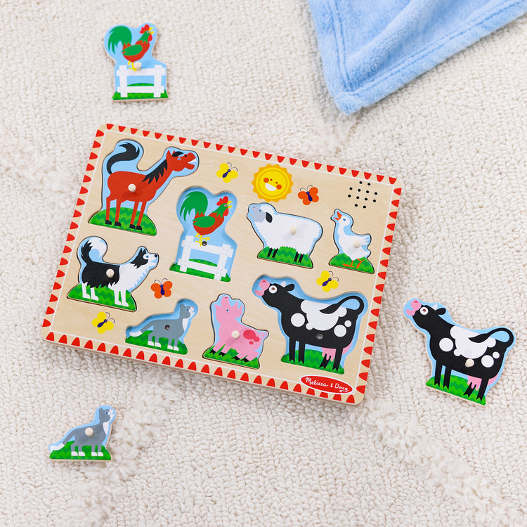 A playroom scene with The Melissa & Doug Farm Animals Sound Puzzle - Wooden Peg Puzzle With Sound Effects (8 pcs)