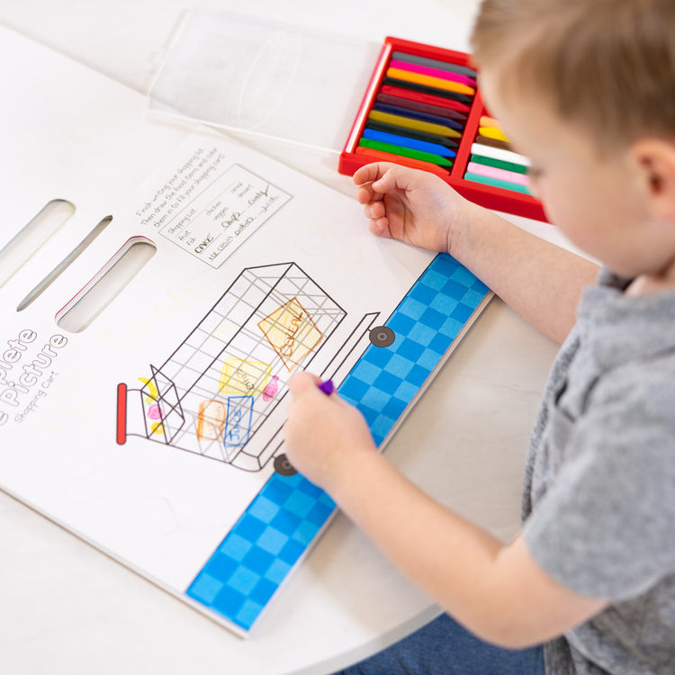 A kid playing with The Melissa & Doug Children's Book - Poke-a-Dot: Who’s in the Ocean (Board Book with Buttons to Pop)