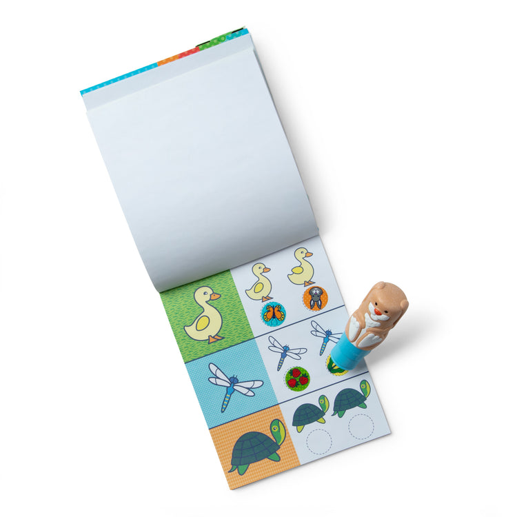 The loose pieces of The Melissa & Doug Sticker WOW!™ Bunny Bundle: 24-Page Activity Pad, Sticker Stamper, 500 Stickers, Mini Pad, Arts and Crafts Fidget Toy Collectible Character