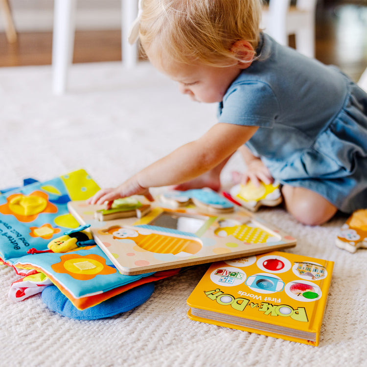 A kid playing with The My First" Collection Gift Set