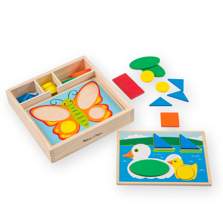 The loose pieces of The Melissa & Doug Beginner Wooden Pattern Blocks Educational Toy With 5 Double-Sided Scenes and 30 Shapes