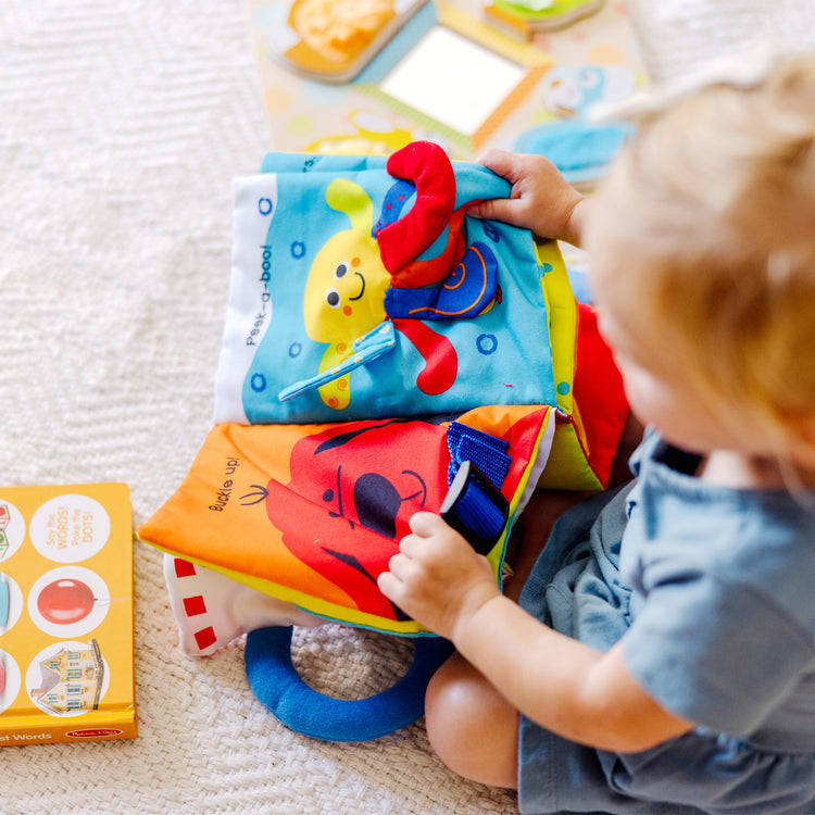 A kid playing with The My First" Collection Gift Set