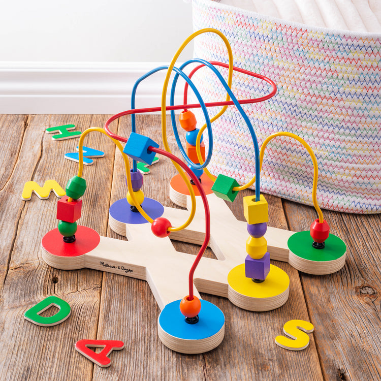 A playroom scene with The Melissa & Doug Classic Bead Maze - Wooden Educational Toy