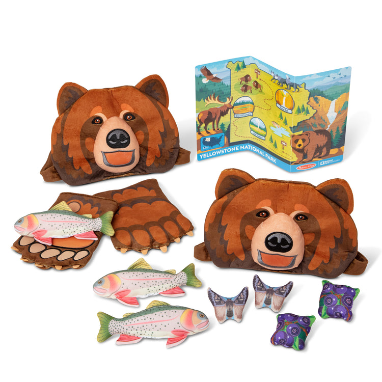 The loose pieces of The Melissa & Doug Yellowstone National Park Grizzly Bear Games and Pretend Play Set with Plush Bear Heads and Bear Paw Gloves