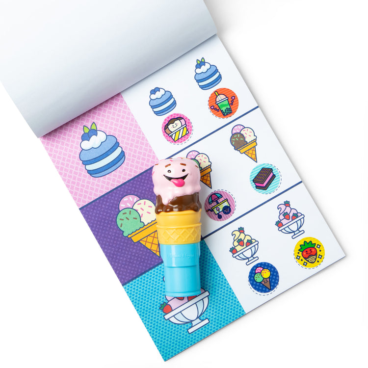 The loose pieces of The Melissa & Doug Sticker WOW!™ Ice Cream Bundle: 24-Page Activity Pad, Sticker Stamper, Mini Activity Pad, 500 Stickers, Arts and Crafts Fidget Toy Collectible Character