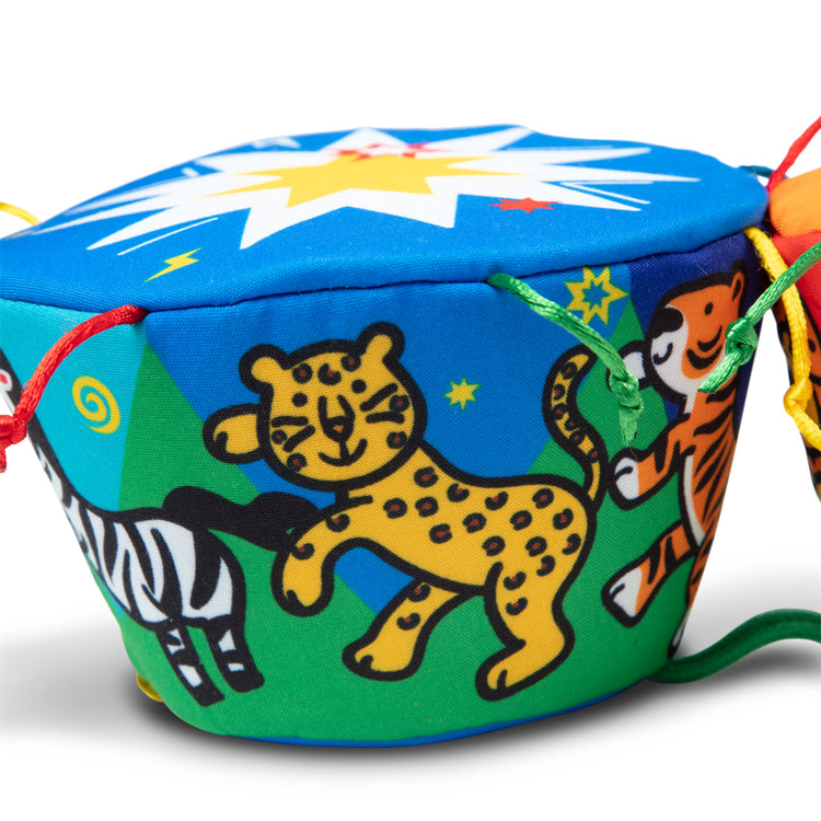 The loose pieces of The Melissa & Doug K's Kids Bongo Drums Soft Musical Instrument
