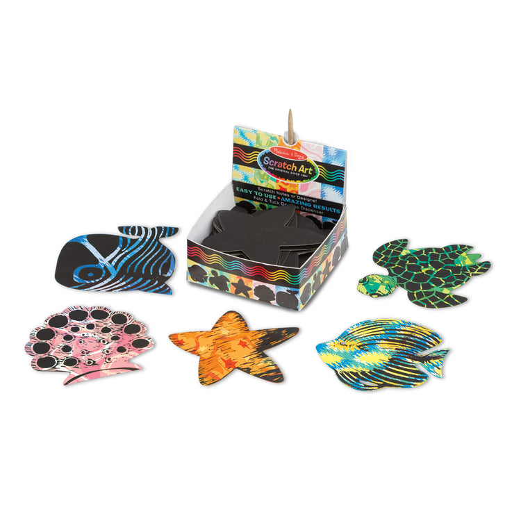 The loose pieces of The Melissa & Doug Scratch Art® Box of 125 Ocean-Themed Shaped Notes in Desktop Dispenser (Approx. 3.5” x 3.5” Each Note)