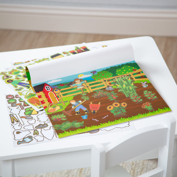 A playroom scene with The Melissa & Doug Reusable Sticker Pad: Farm - 280+ Stickers, 5 Scenes