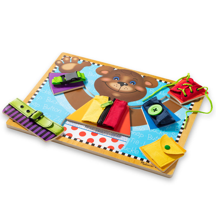 The loose pieces of The Melissa & Doug Basic Skills Puzzle Board - Wooden Educational Toy