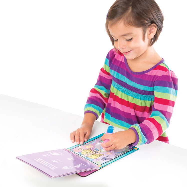 A child on white background with The Melissa & Doug On the Go Water Wow! Reusable Water-Reveal Activity Pads, 3-pk, Colors and Shapes, Fairy Tales, Animals